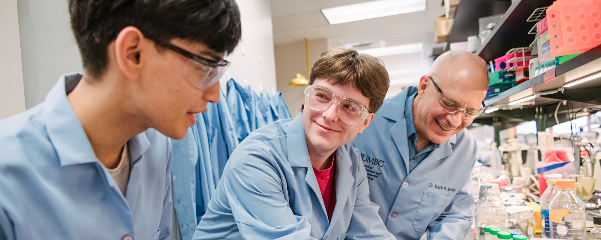 three men in lab